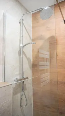a shower with a glass door in a bathroom at Centre Cannes, Le Grand Turkheim By Palmazur Vacances in Cannes