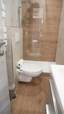 a bathroom with a toilet and a glass shower at Centre Cannes, Le Grand Turkheim By Palmazur Vacances in Cannes