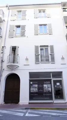 a white building with a door and a window at Proche Carlton & Croisette, Appartement 302 - Palmazur Vacances in Cannes