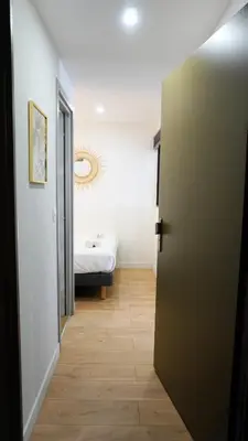 a hallway with a door leading to a bedroom at Proche Carlton & Croisette, Appartement 302 - Palmazur Vacances in Cannes