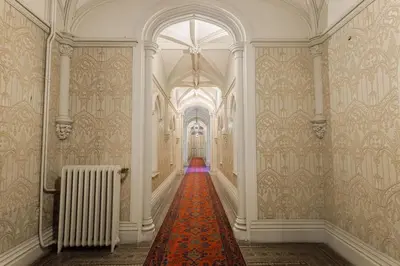 a hallway with a red carpet in a building at Le Château Vallombrosa by Halldis in Cannes