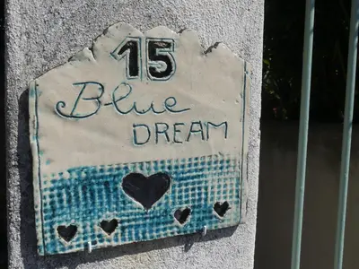 a blue dream sign on the side of a building at Blue Dream Cannes Guest House in Cannes