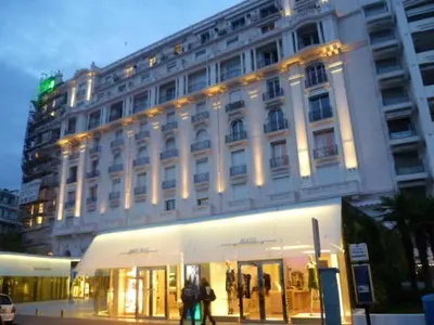 a large white building with people walking in front of it at Studio Croisette in Cannes