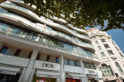 a white building with a sign in front of it at PLEIN SUD - le tapis rouge Croisette in Cannes