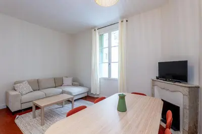 a living room with a couch and a table at Villa CANA in Cannes