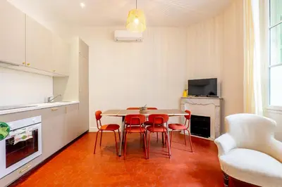 a kitchen and dining room with a table and chairs at Villa CANA in Cannes