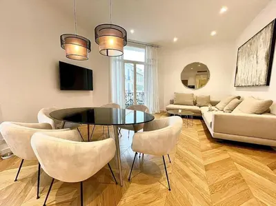 a living room with a table and chairs and a couch at KEEP IN TOUCH 3 BEDROOM/3 BATHROOM/WIFI in Cannes