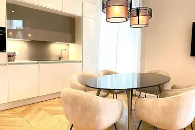 a dining room with a glass table and chairs at KEEP IN TOUCH 3 BEDROOM/3 BATHROOM/WIFI in Cannes