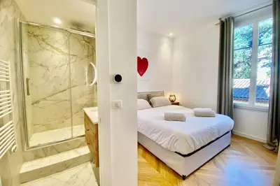 a bedroom with a bed and a walk in shower at KEEP IN TOUCH 3 BEDROOM/3 BATHROOM/WIFI in Cannes