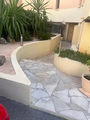 a stone walkway in front of a building at Quartier Suquet Marché Forville 4 pers. Terrasse in Cannes