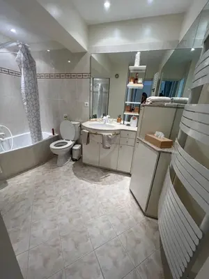 a bathroom with a toilet and a tub and a sink at Quartier Suquet Marché Forville 4 pers. Terrasse in Cannes