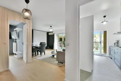 a kitchen and living room with a dining room at Le Sun Valley - Vidéoprojecteur et Terrasse Zen in Cannes