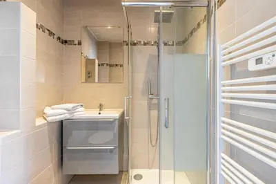 a bathroom with a shower and a sink at Magnificent studio with terrace - center of Cannes in Cannes