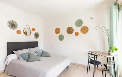 a white bedroom with a bed and a desk at L'Ariane - Studio - 5 min Plage - Climatisé in Cannes