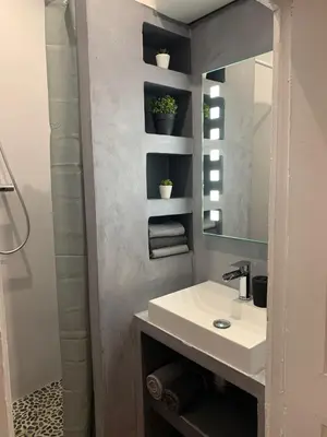 a bathroom with a sink and a mirror at THE HEART OF CANNES 5MIN BY LA CROISETTE AND BEACH in Cannes