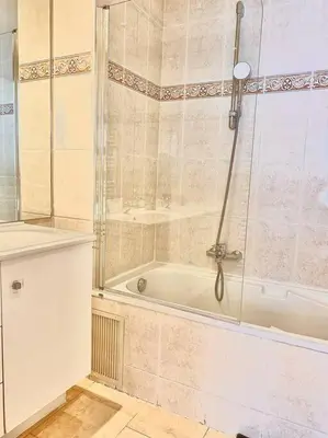 a bathroom with a shower and a bath tub at Appartement Cannes 3 chambres - 8B2 in Cannes
