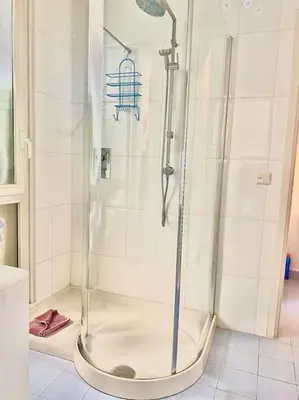 a shower with a glass door in a bathroom at Appartement Cannes 6 chambres - 8B3 in Cannes