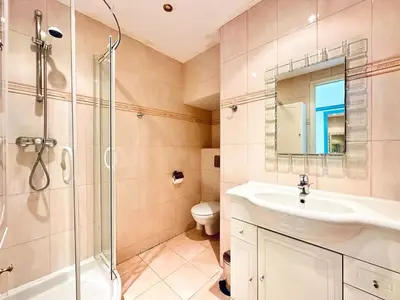 a bathroom with a shower and a sink and a toilet at Miramar - Studio Croisette - Vue Mer Panoramique in Cannes