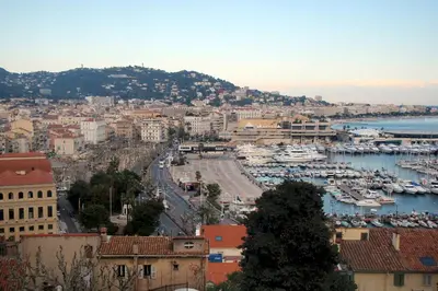 a view of a city with a harbor and boats at CannesVacationRental by AmericanVacationLIving 1BR in Cannes