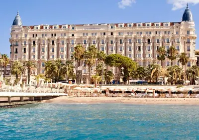 a large building with a beach in front of it at CannesVacationRental by AmericanVacationLIving 1BR in Cannes