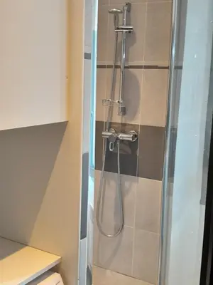 a shower with a glass door in a bathroom at World Apartment Cannes in Cannes