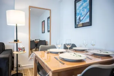 a dining room table with wine glasses on it at Lisa's Rooftop - Toit-terrasse à 2mn du Palais et des plages de la Croisette in Cannes