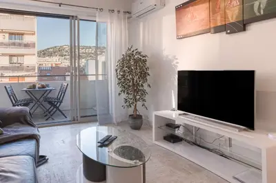 a living room with a flat screen tv on a wall at 