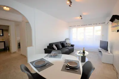 a living room with a white table and a couch at 