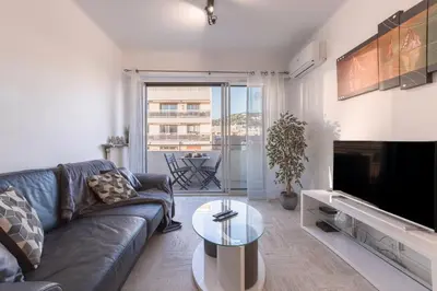 a living room with a couch and a tv and a table at 