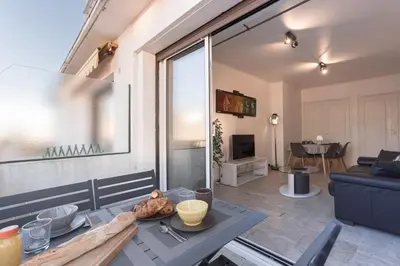 a living room with a couch and a table in a room at 