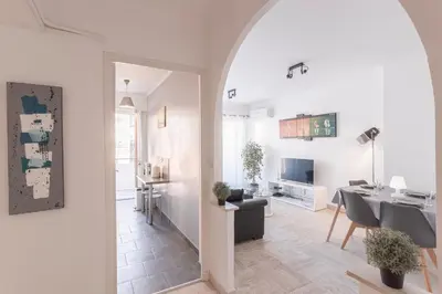 a living room with a table and a dining room at 