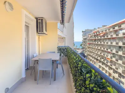 a balcony with a table and chairs in a building at Le Maubourg by Winsome Destination in Cannes