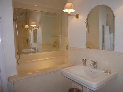 a bathroom with a sink and a mirror at ANNA CLAIRE festival plages GAZ5213 in Cannes