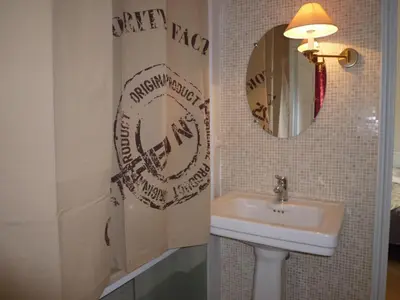 a bathroom with a sink and a mirror at ANNA CLAIRE festival plages GAZ5213 in Cannes