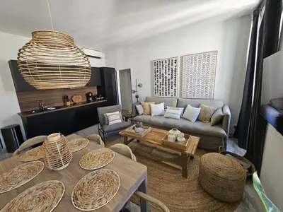 a living room with a couch and a table at PALOMA in Cannes