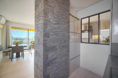a room with a brick wall and a dining room at FRGK 