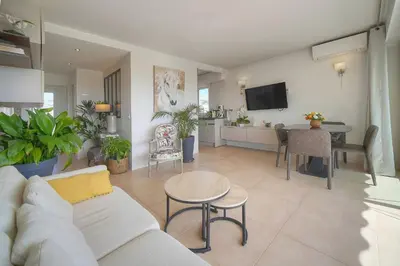 a living room with a couch and a table at FRGK 