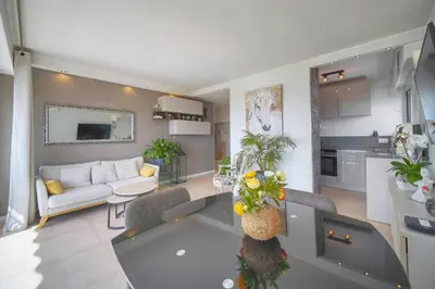 a living room with a couch and a table at FRGK 