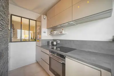 a kitchen with a counter top and a stove at FRGK 