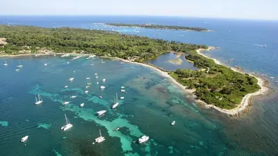 an aerial view of a small island with boats in the water at GRAY 2a7 in Cannes