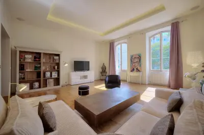 a living room with a couch and a coffee table at IMMOGROOM - T5 de standing - 130m - Terrace - Parking - AC in Cannes
