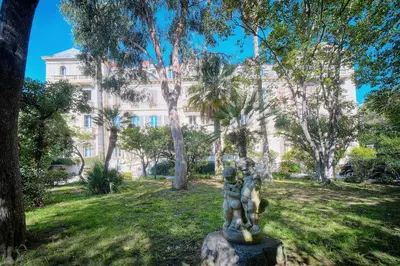 a statue in a park in front of a building at IMMOGROOM - T5 de standing - 130m - Terrace - Parking - AC in Cannes