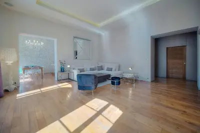 a living room with a couch and a table at IMMOGROOM - T5 de standing - 130m - Terrace - Parking - AC in Cannes