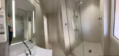 a bathroom with a shower with a glass door at Renovated Cannes Centre Banane balcon in Cannes