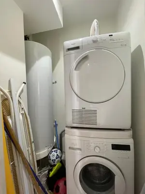a washing machine with a mirror on top of it at Renovated Cannes Centre Banane balcon in Cannes