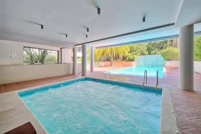 a large swimming pool in a house at Appartement , piscine, terrasse, proche croisette in Cannes