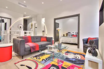 a living room with a couch and a table at Appartement Cannes 4 chambres - 5G in Cannes