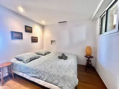 a bedroom with a bed and a window at Marjolaine luxury sea view, by Welcome to Cannes in Cannes