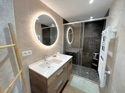 a bathroom with a sink and a mirror at Marjolaine luxury sea view, by Welcome to Cannes in Cannes