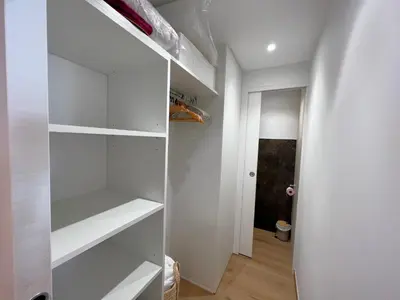 a white walk in closet with white shelves at Marjolaine luxury sea view, by Welcome to Cannes in Cannes